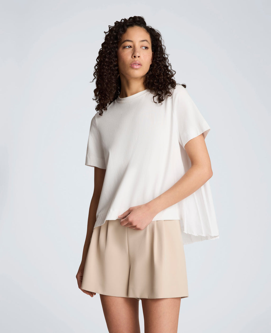 Short Sleeve Crewneck Tee with Pleated Asymmetrical Hem