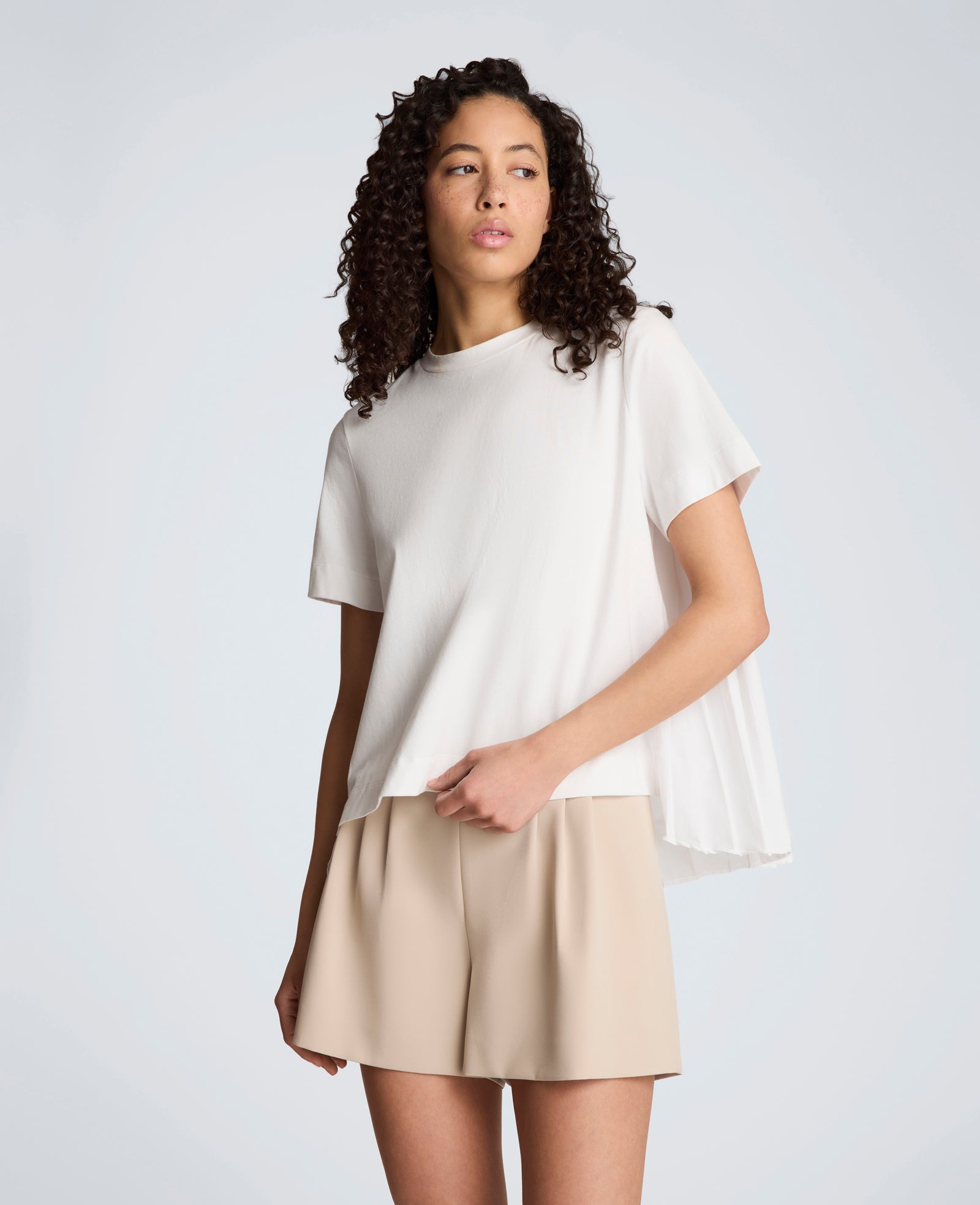 Short Sleeve Crewneck Tee with Pleated Asymmetrical Hem