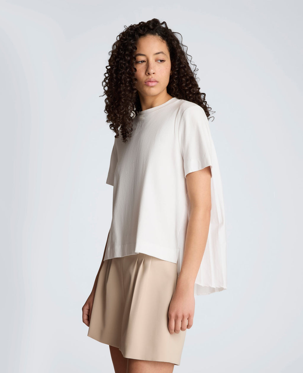 Short Sleeve Crewneck Tee with Pleated Asymmetrical Hem